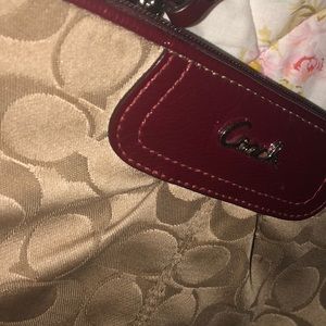 This is a cute coach small purse